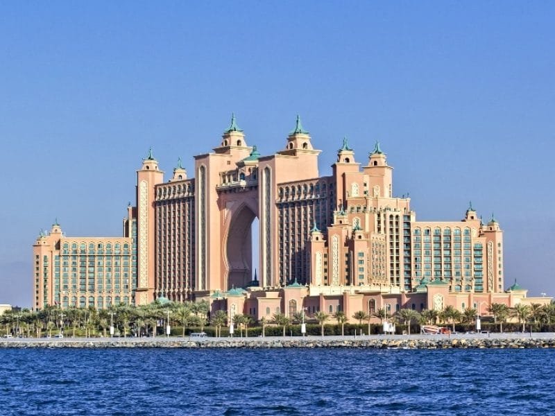 Visit Dubai_Background view from the water of the building the Atlantis Hotel at the top of the Palm in Dubai