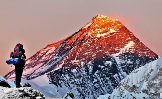 Evening Colored view of Mount Everest from Gokyo Valley with tourist on the way to Everest Base Camp._Great Views of Everest: Pikey Peak Trek.