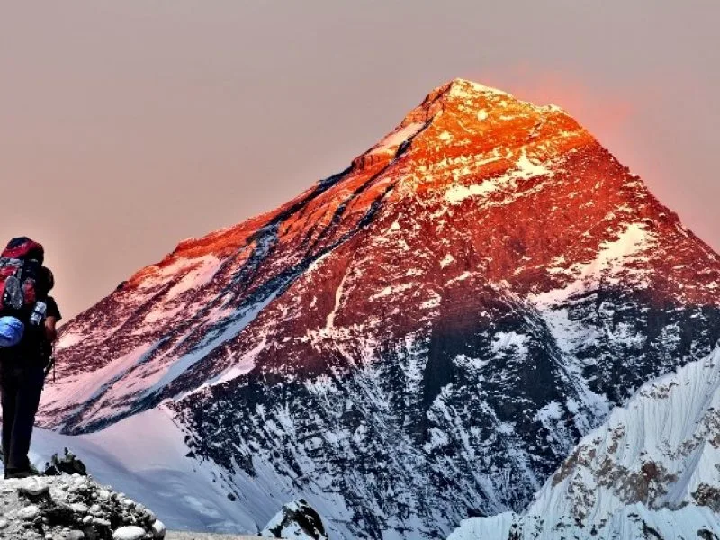 Evening Colored view of Mount Everest from Gokyo Valley with tourist on the way to Everest Base Camp._Great Views of Everest: Pikey Peak Trek.