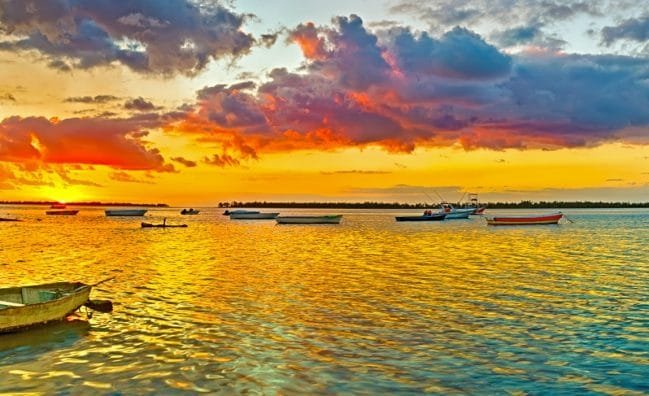 Fishing Boat at Sunset Time. Le Morn Brabant on Background._Memories of Mauritius.