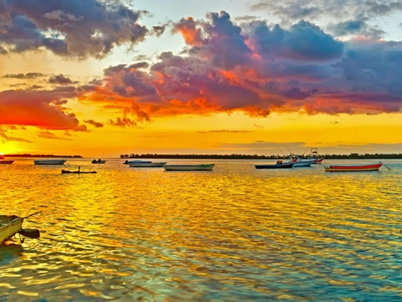 Fishing Boat at Sunset Time. Le Morn Brabant on Background._Memories of Mauritius.